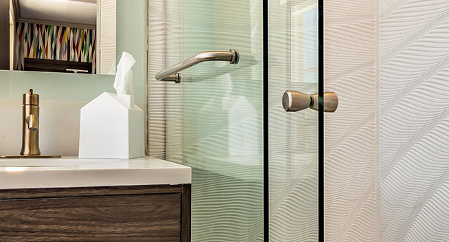 Queen Guest Bathroom with large sliding shower doors, and essentials.